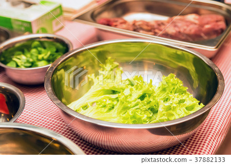 Fresh lettuce in bowl close Fresh lettuce in bowl close 37882133