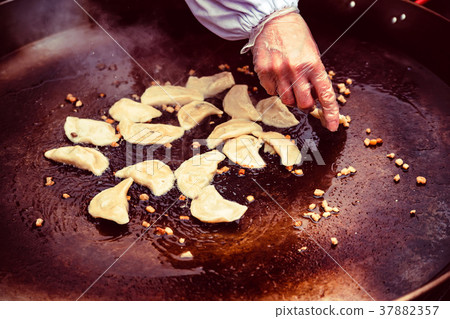 Cooking Russian dumplings vareniki close Cooking Russian dumplings vareniki close 37882357