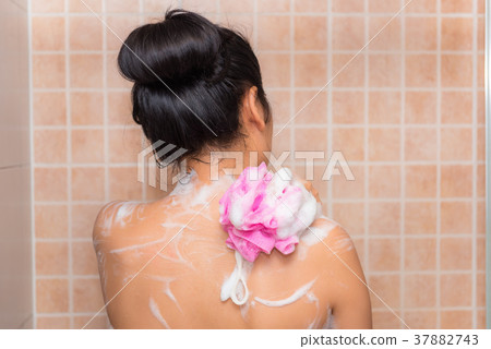 Portrait of beautiful woman taking shower Portrait of beautiful woman taking shower 37882743