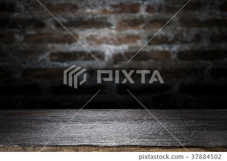 Wood table top on old dark brick wall background. Wood table top on old dark brick wall background. 37884502