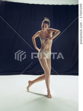 Young teen dancer ion white floor background. Young teen dancer ion white floor background. 37885099