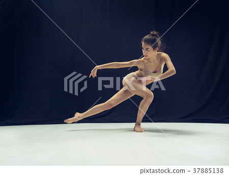 Young teen dancer ion white floor background. Young teen dancer ion white floor background. 37885138