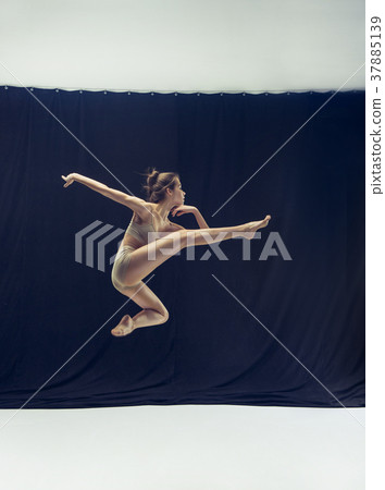 Young teen dancer ion white floor background. Young teen dancer ion white floor background. 37885139