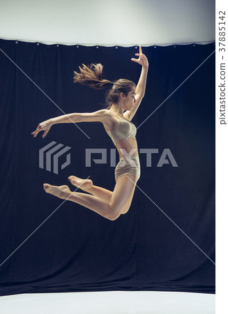 Young teen dancer ion white floor background. 37885142