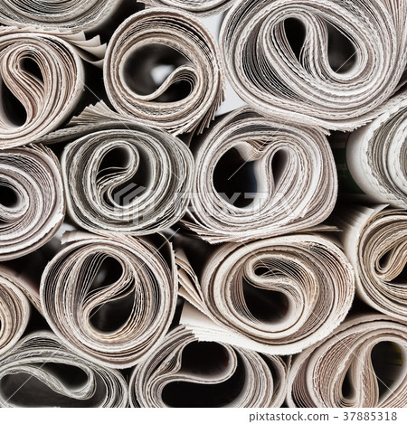 Rolls of newspapers. 37885318