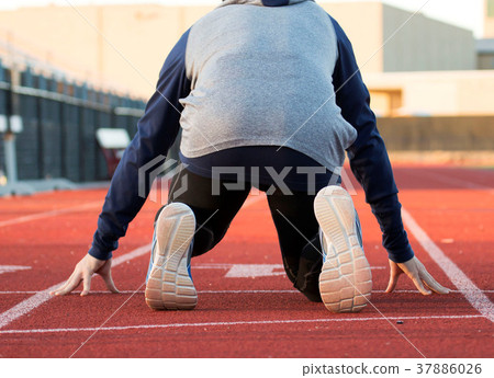 Sprinter in the on you mark position 37886026