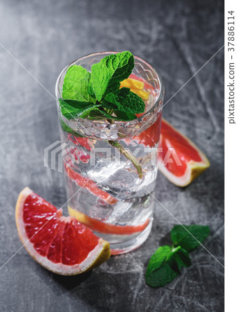 Cold cocktail with grapefruit and mint Cold cocktail with grapefruit and mint 37886114