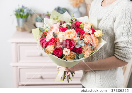beautiful luxury bouquet of mixed flowers in woman 37886235