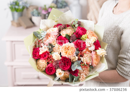 beautiful luxury bouquet of mixed flowers in woman 37886236