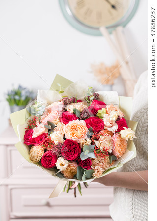 beautiful luxury bouquet of mixed flowers in woman 37886237
