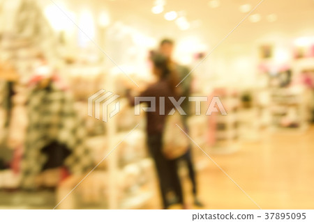 blurred image people walking in shopping centre. blurred image people walking in shopping centre. 37895095