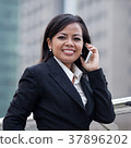 Business woman using mobile phone. 37896202