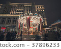 Merry-go-round carousel in movement at night 37896233