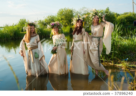 Beautiful women with flower wreath in water Beautiful women with flower wreath in water 37896240