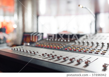 od adjusters and red buttons of a mixing console od adjusters and red buttons of a mixing console 37896942