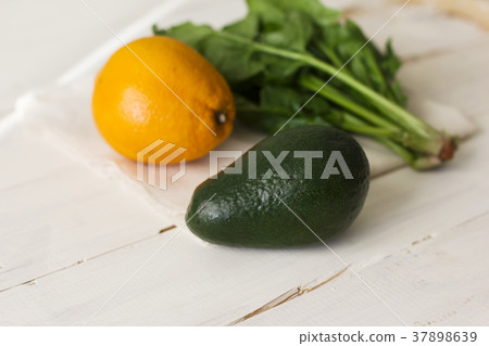 Bunch of fresh spinach, orange and avocado Bunch of fresh spinach, orange and avocado 37898639
