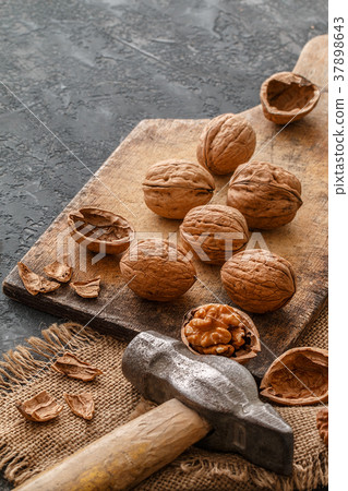 Walnuts  on dark stone  background. Healthy fo 37898643