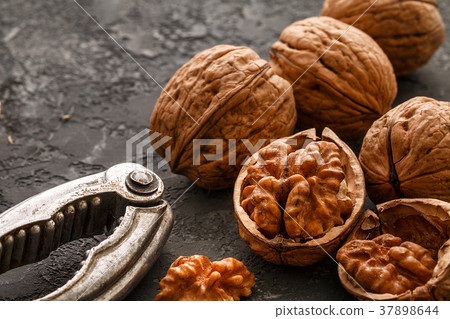 Walnuts  on dark stone  background, closeup. fo 37898644