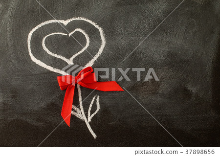 Valentine heart and red bow on the chalkboard Valentine heart and red bow on the chalkboard 37898656