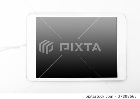 White tablet laying on white background White tablet laying on white background 37898665