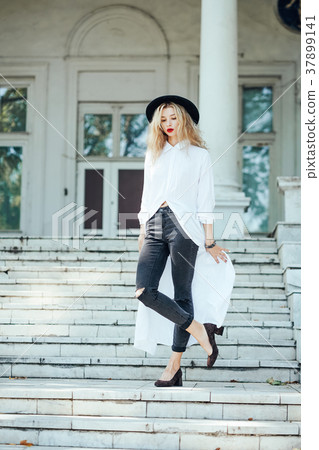 Girl is posing on the stone steps Girl is posing on the stone steps 37899141