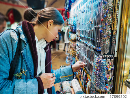 Young girl tourist walking in the souvenir market 37899202