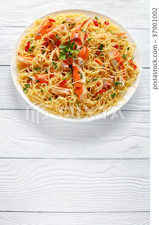 spaghetti with cracked Crab legs, top view spaghetti with cracked Crab legs, top view 37901002