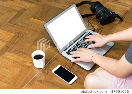Morking on laptop computer with camera and coffee Morking on laptop computer with camera and coffee 37901036
