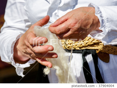 cotton spinner transforming raw wool 37904004