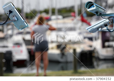 CCTV cam Marina and woman on blurry background CCTV cam Marina and woman on blurry background 37904152