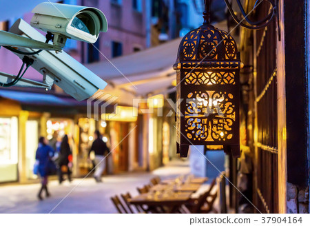 CCTV camera street by night on blurry background 37904164