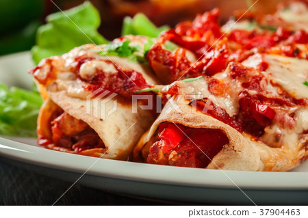 Traditional mexican enchiladas with chicken meat 37904463