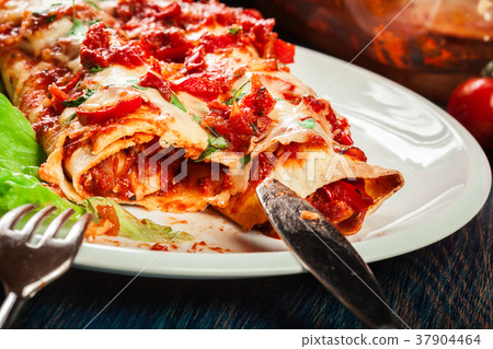 Traditional mexican enchiladas with chicken meat 37904464
