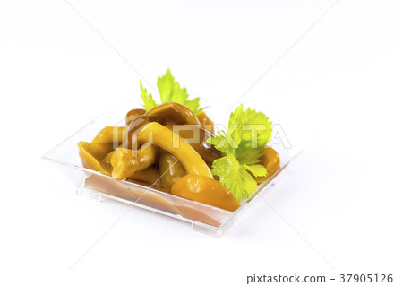 Salad snack from marinated mushrooms in a plastic Salad snack from marinated mushrooms in a plastic 37905126