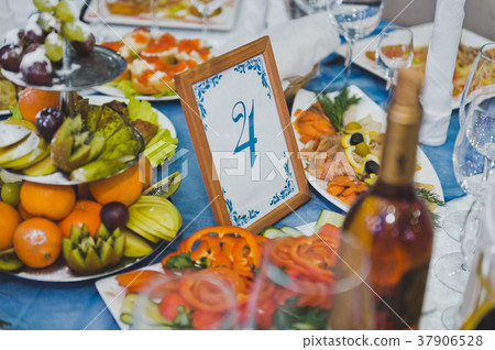 Beautifully decorated holiday table with snacks Beautifully decorated holiday table with snacks 37906528