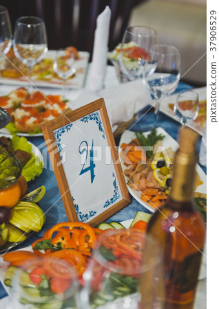 Beautifully decorated holiday table with snacks Beautifully decorated holiday table with snacks 37906529