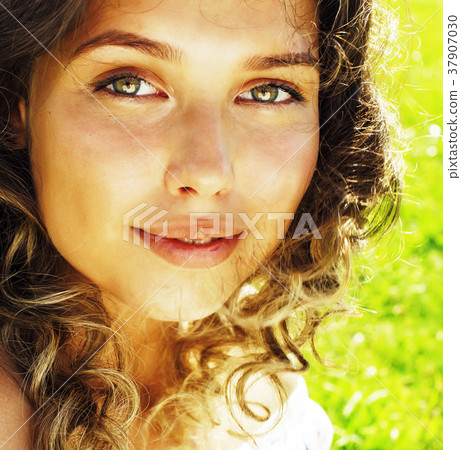 young cute summer girl on green grass outside 37907030