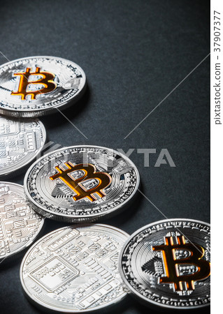 coins of the bitcoin cryptocurrency on a black coins of the bitcoin cryptocurrency on a black 37907377