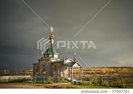 Wooden Church on the background of a stormy sky 37907761