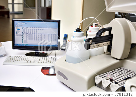 Biochemical analyzer and computer in laboratory Biochemical analyzer and computer in laboratory 37911312