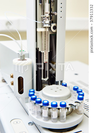 Biochemical analyzer with turret in laboratory Biochemical analyzer with turret in laboratory 37911332