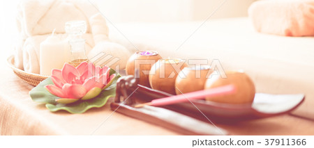 Spa candles and equipment object beside spa bed Spa candles and equipment object beside spa bed 37911366