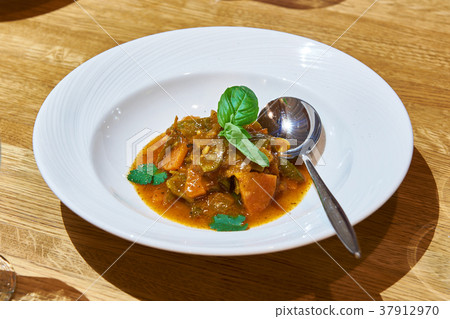 Dish with steamed vegetables on table 37912970