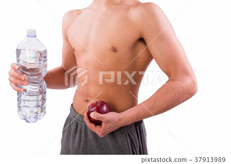 Young sporty man holding red apple Young sporty man holding red apple 37913989