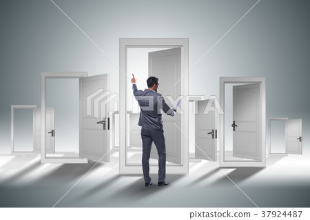 Businessman facing many business opportunities Businessman facing many business opportunities 37924487