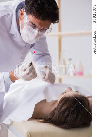 Police coroner examining dead body corpse in 37925075