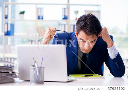 Businessman working in the office Businessman working in the office 37925102
