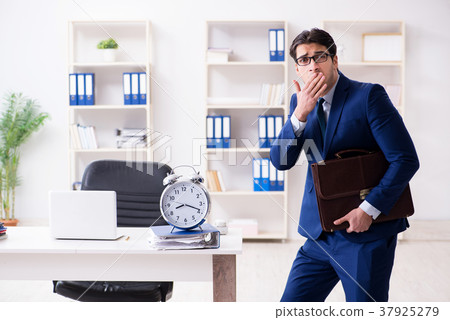 Businessman in rush trying to meet deadline 37925279