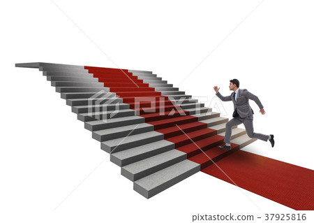 Young businessman climbing stairs and red carpet 37925816