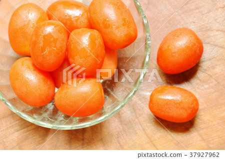 cherry tomatoes in glass cup on table 37927962